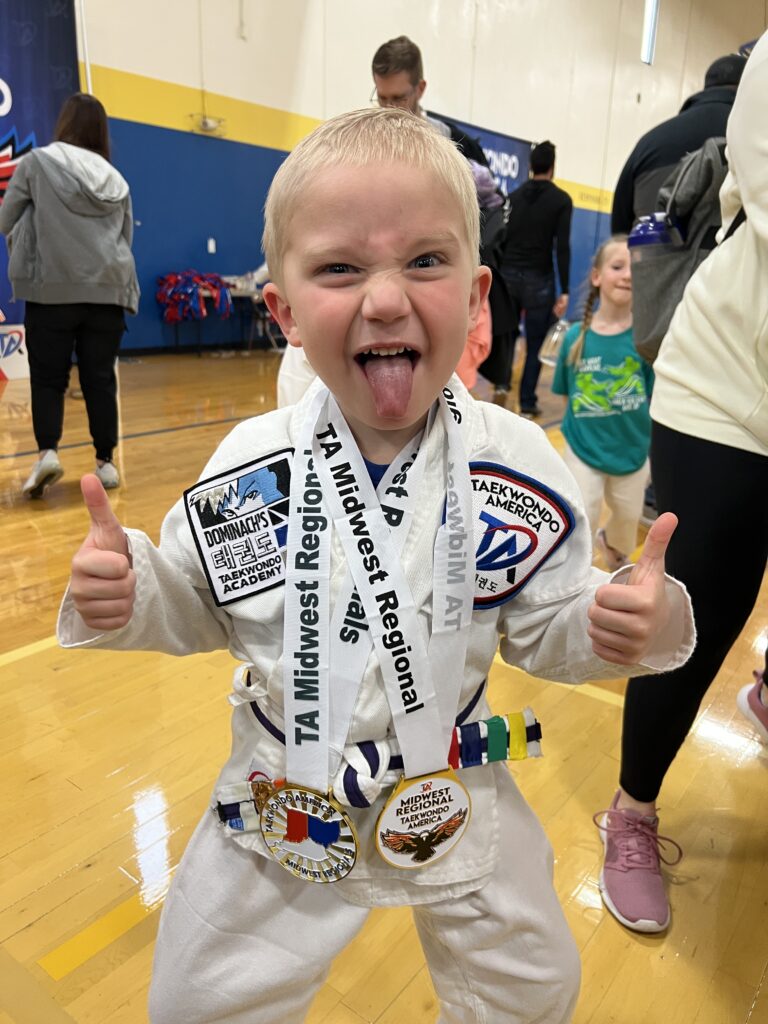 First Taekwondo tournament and showing off his medals