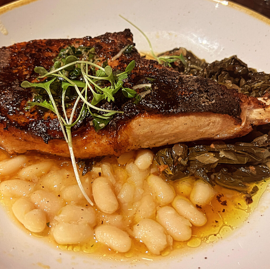 Pork Tomahawk Chop, White Beans, Bitter Greens from Coppins